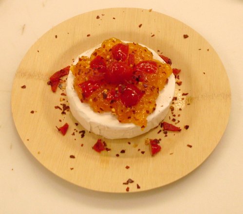 Brie topped with Peach Chutney, spicy Peppadews and Chili Flakes