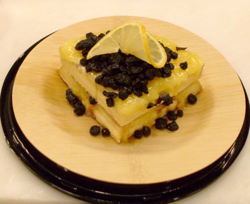 Brie de Nangis topped with Lemon Curd and Dried Blueberries