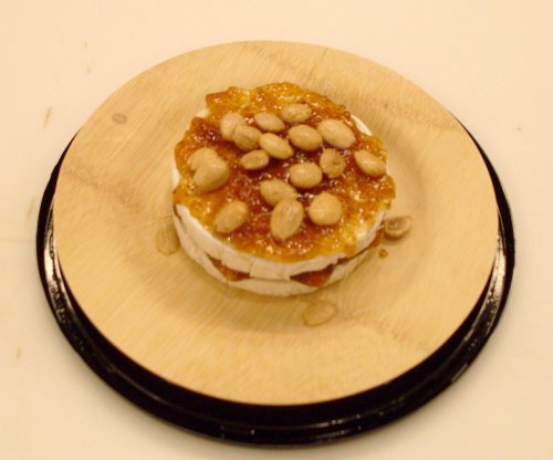 Brie topped with Fig-Orange Spread and Marcona Almonds